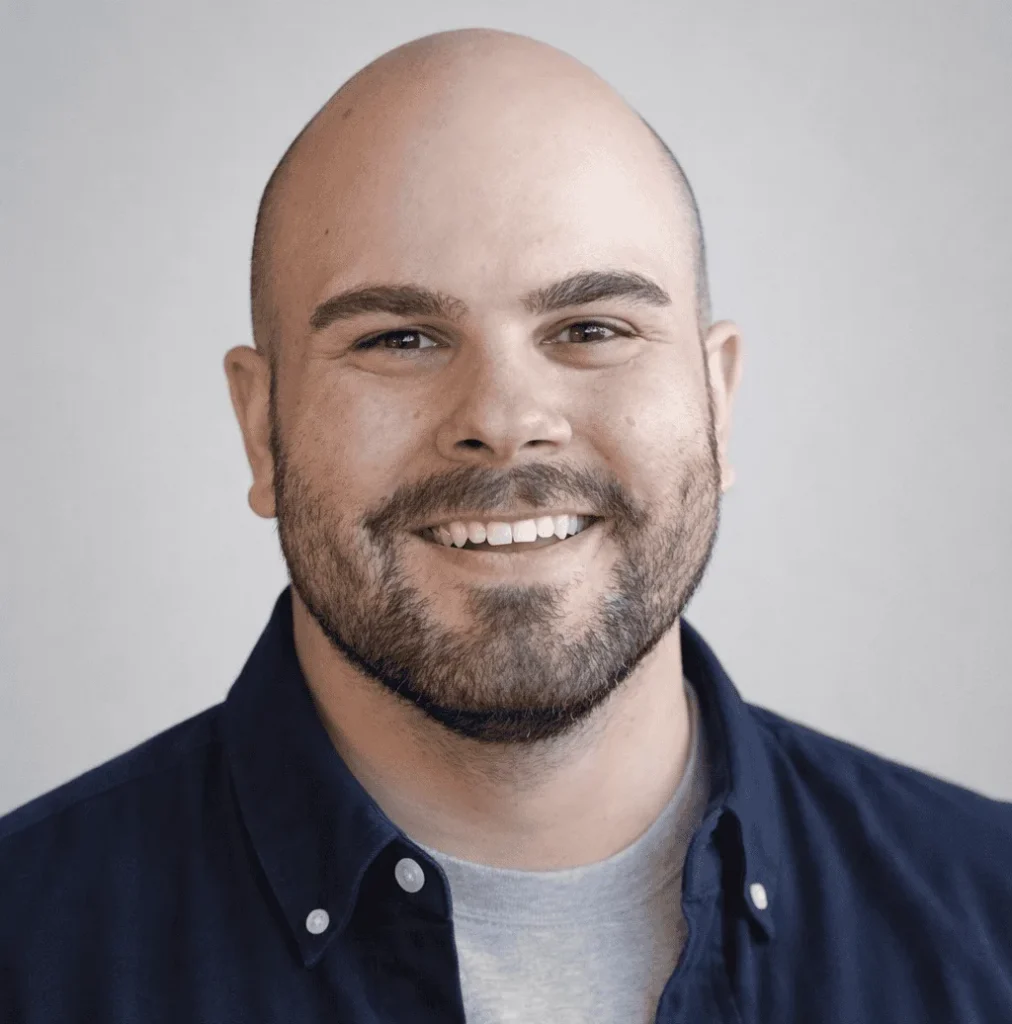 Brendan Morgan, smiling with a beard wearing a navy blue shirt, representing Black River Secure, a managed IT services company in Fuquay-Varina.