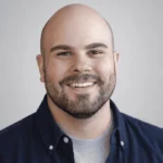 Brendan Morgan, smiling with a beard wearing a navy blue shirt, representing Black River Secure, a managed IT services company in Fuquay-Varina.