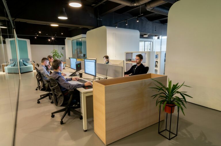 Small office team working at desks with computers